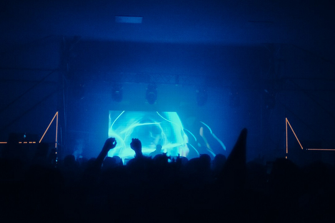 Live concert with stage lights and audience